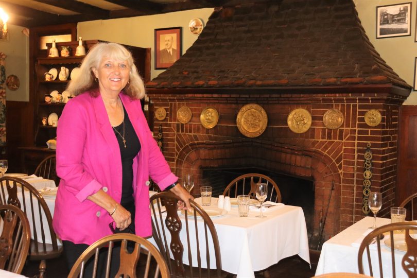 Real estate agent Carol James inside The Fireside Inn