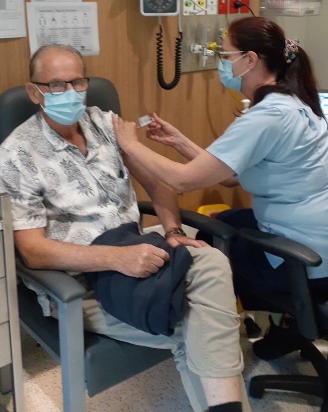 Dr David Rivet receiving COVID-19 vaccination at South East Regional Hospital.