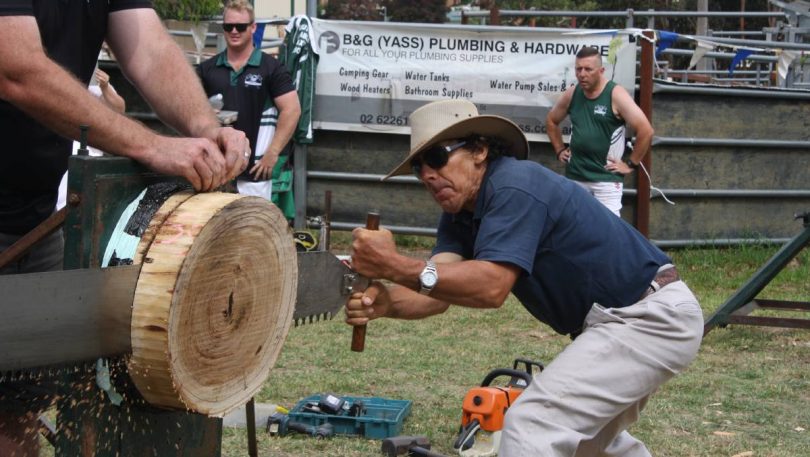 Man wood sawing at Yass Show.