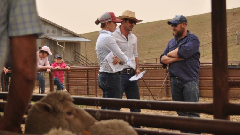 Judges Georgia Waters and Alan McCormack with farmer Alex Wheelwright during the 2019 Crookwell Flock Ewe Competition.