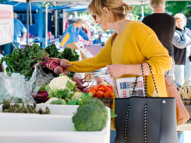 Woman shopping for produce at Yass Community Markets