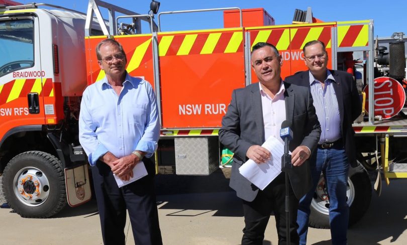 Member for Monaro John Barilaro with Queanbeyan-Palerang Regional Council Mayor Tim Overall and Cr Mark Schweikert standing in front of fire truck from Braidwood