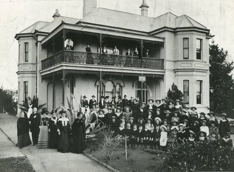 Historical photo of people standing outside Littleton House in Bega