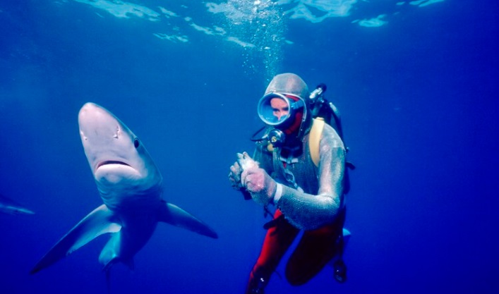 Valerie Taylor underwater with shark