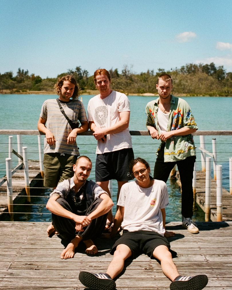 Band members from Thunder Fox standing on wharf