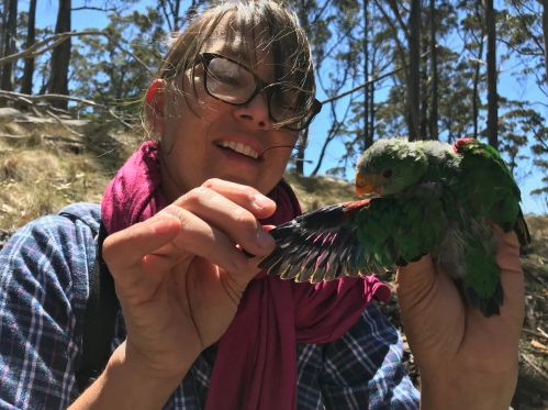Dr Maggie Watson holding native bird