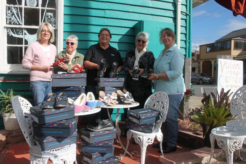 Rene Sundell, Lorraine James, Jenny Whitaker, Beth Dogan and Jenny Taylor with donated shoes in Cobargo