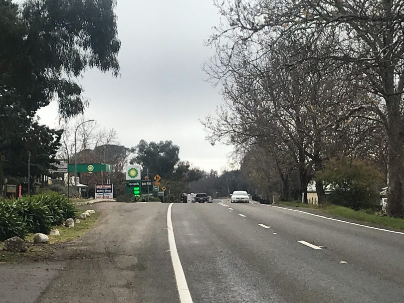 Cars on main road through Murrumbateman with BP service station in distance