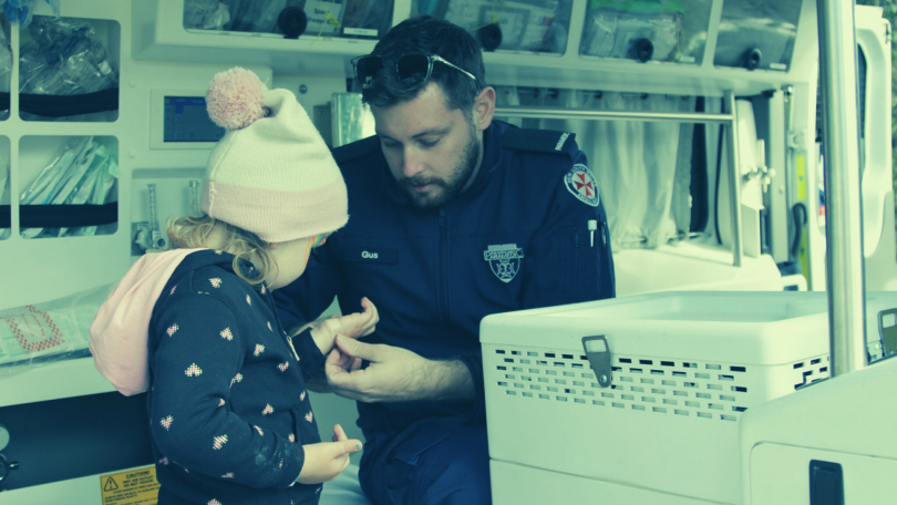 Paramedic treating child