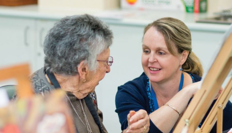 Palliative care volunteer with elderly lady