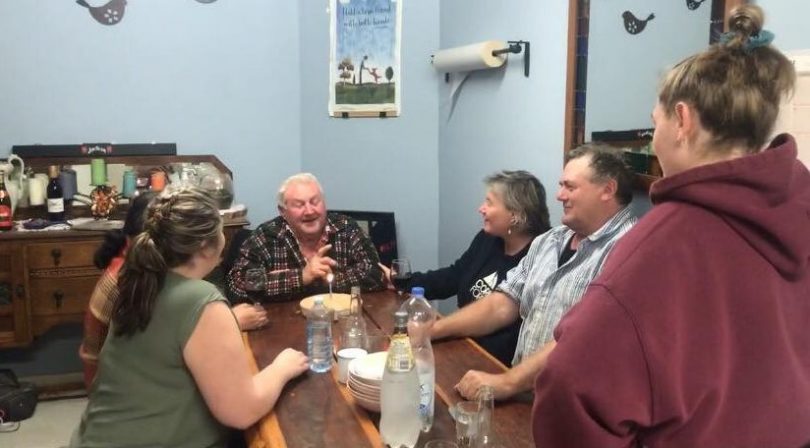 Bernie O'Brien with family around table
