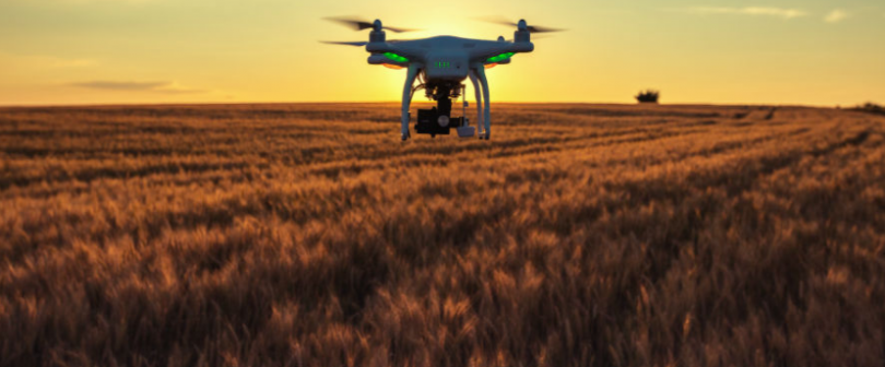 Drone flying above high-tech farm