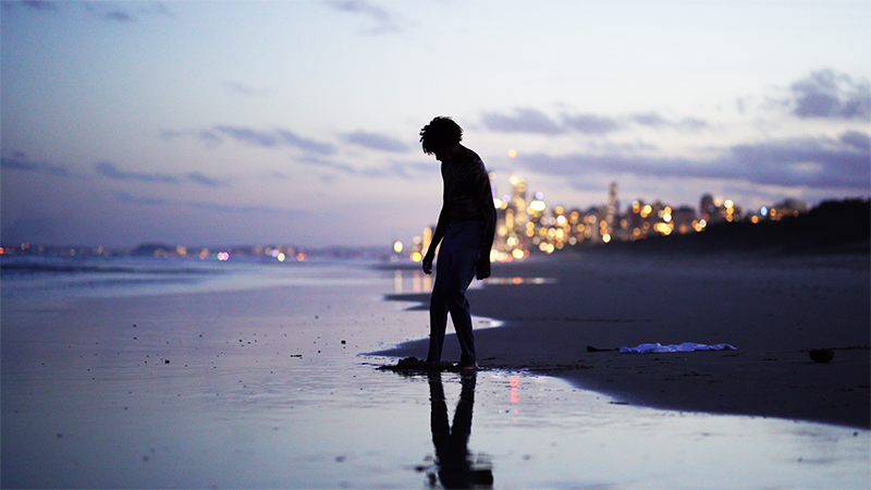 Boy standing on beach from short film 'BAMA'