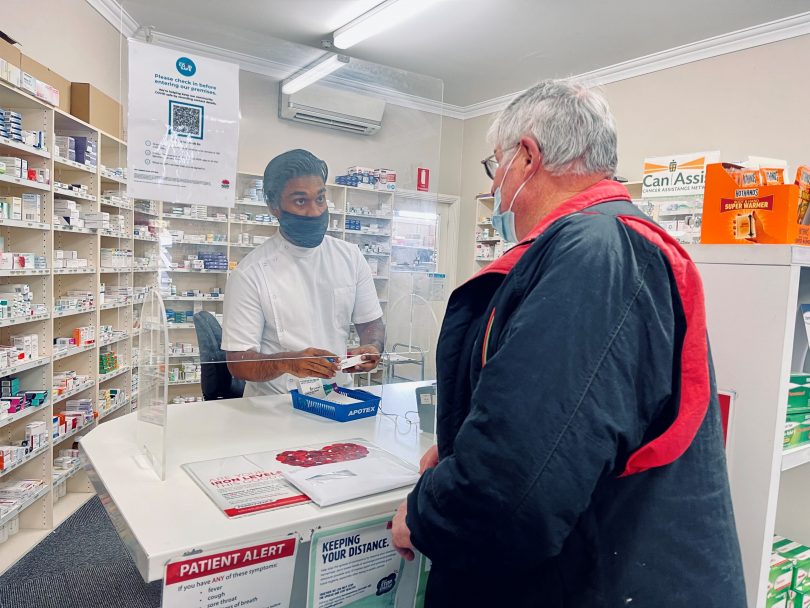Shabab Hasan and customer at Marulan Pharmacy