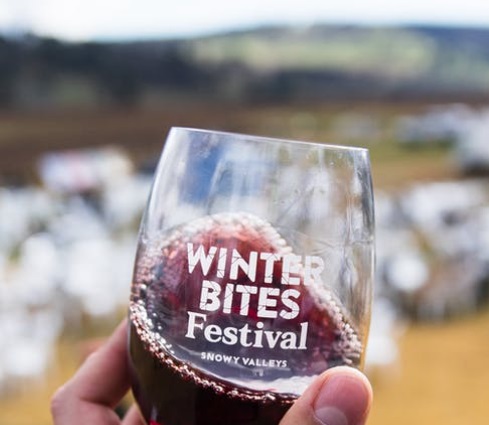 Winter Bites Festival logo on glass of red wine