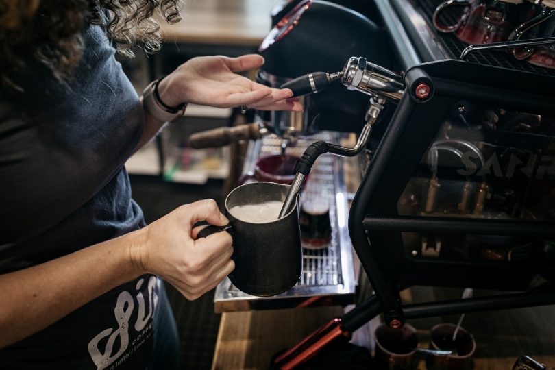 Barista making coffee at Trader & Co in Yass