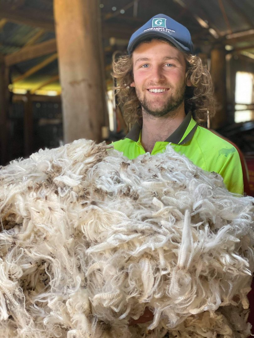 Wil Stanley holding wool