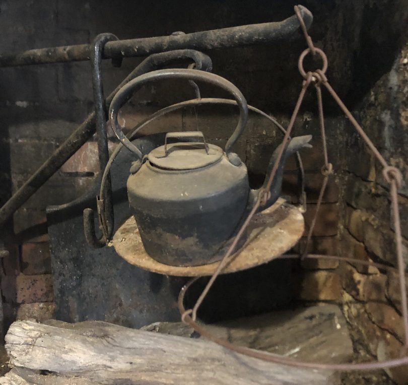 Old kettle on wood stove