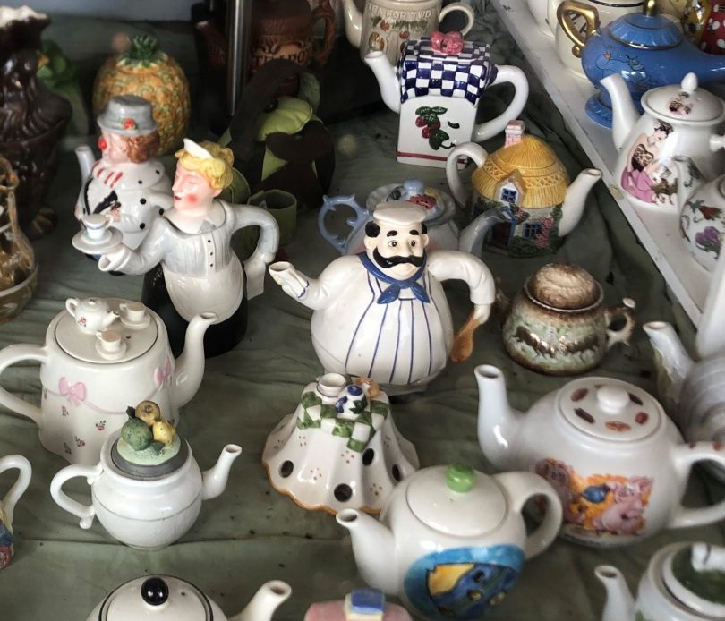 Teapot collection in front window of Boorowa Community Op Shop