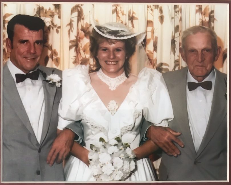 Michelle Apps with her father and grandfather on her wedding day