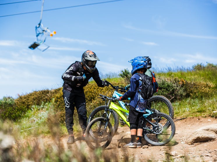 Kids on mountain bikes with instructor