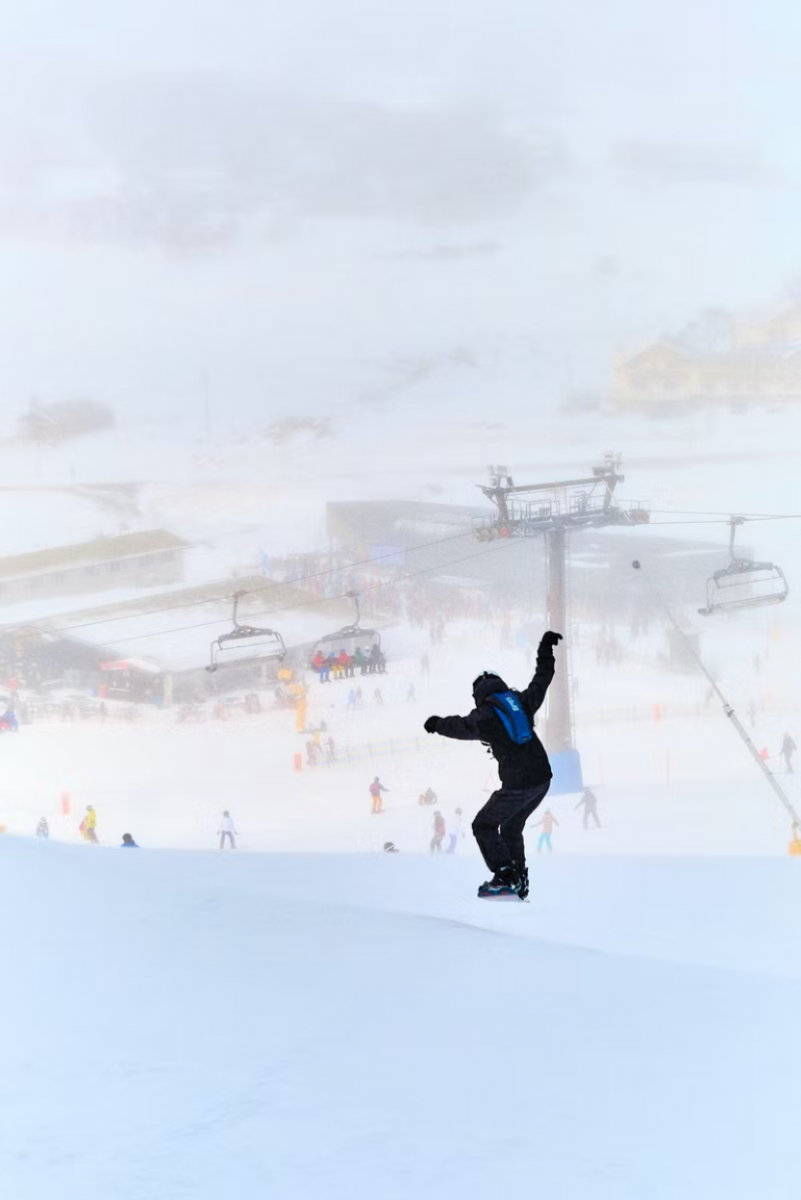 A skier flies down a run at Perisher Resort, Snowy Mountains.