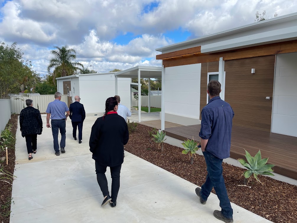 group examines home constructed by The Building Supply Company 