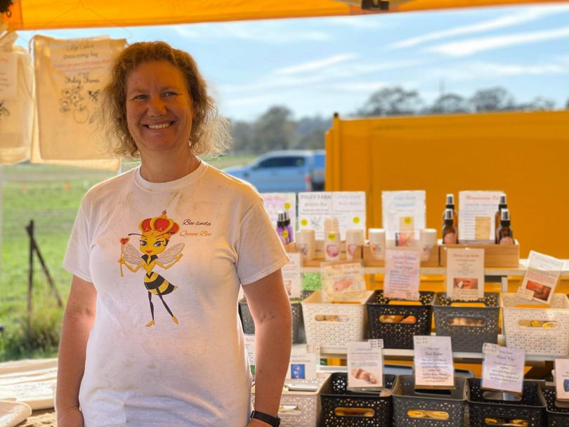 Woman standing in front of honey