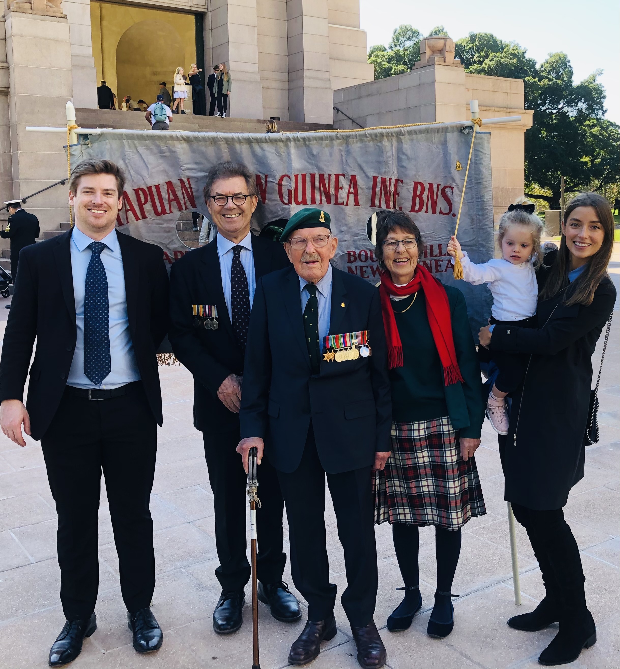 Family at war memorial