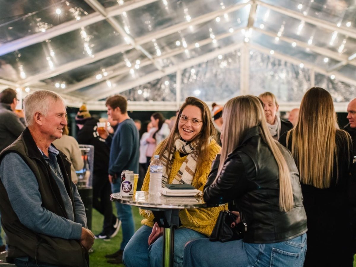 People. enjoy drinks at a night market