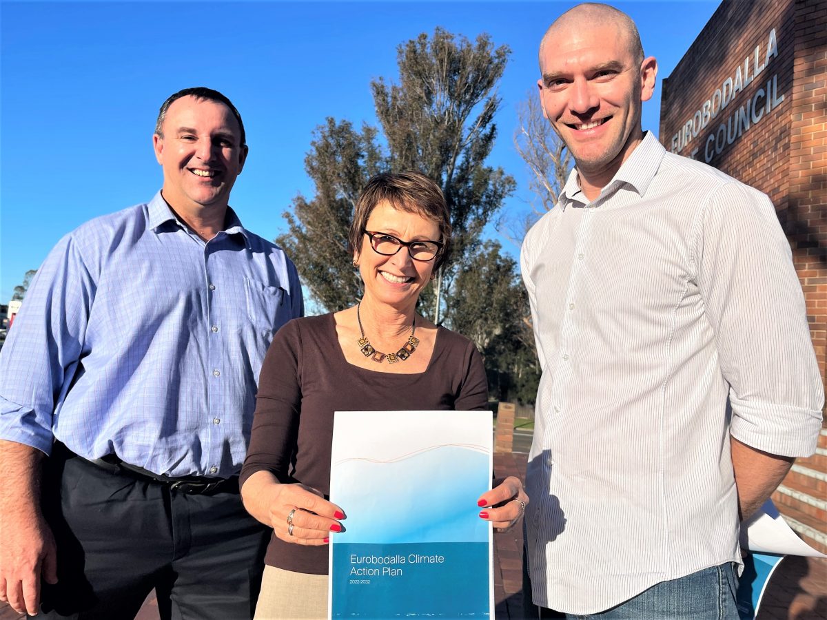 Eurobodalla Council's director of planning Lindsay Usher, manager of environmental services Deb Lenson and Mayor Mathew Hatcher holding a copy of a climate action plan