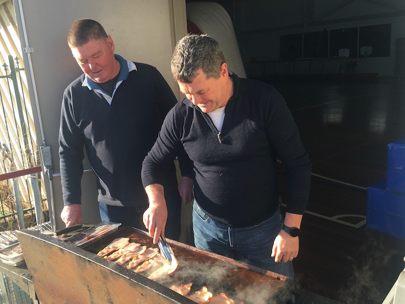 Men barbecuing breakfast