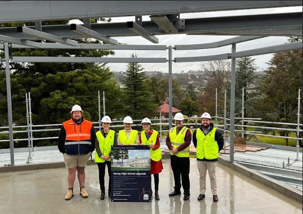 Dean Bailey with Anna Barker, Principal of Young High School, Alison Foreman, Deputy Mayor of Hilltops Council, Steph Cooke, Member of Cootamundra, Anthony O'Reilly, General Manager of Hilltops Council, and Marty Smith of Schools Infrastructure stand in high visibility vests