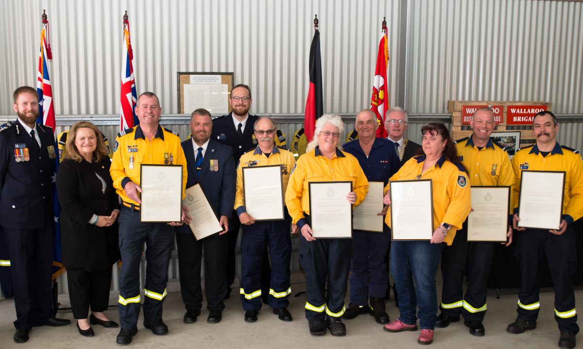 Rural firefighters holding awards