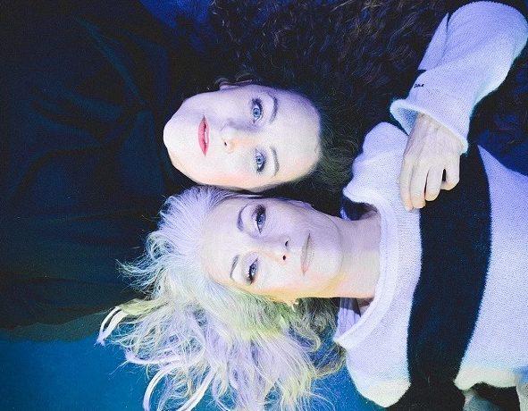 Wendy Matthews and Grace Knight lying on the ground
