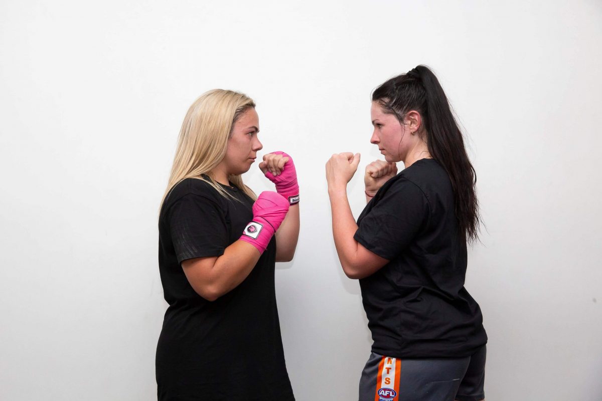 Two women boxing