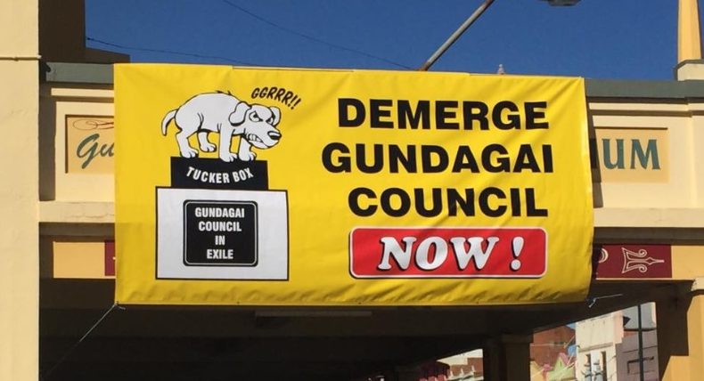 signage on storefront saying Demerge Gundagai Council Now.