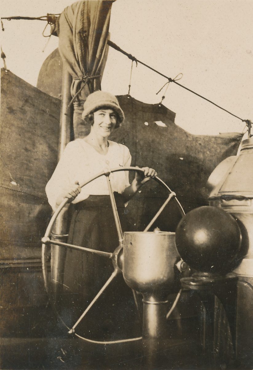 woman steering ship