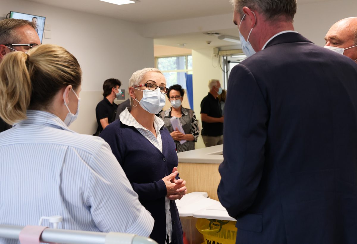 Nurse speaking to NSW premier Dominic Perrottet