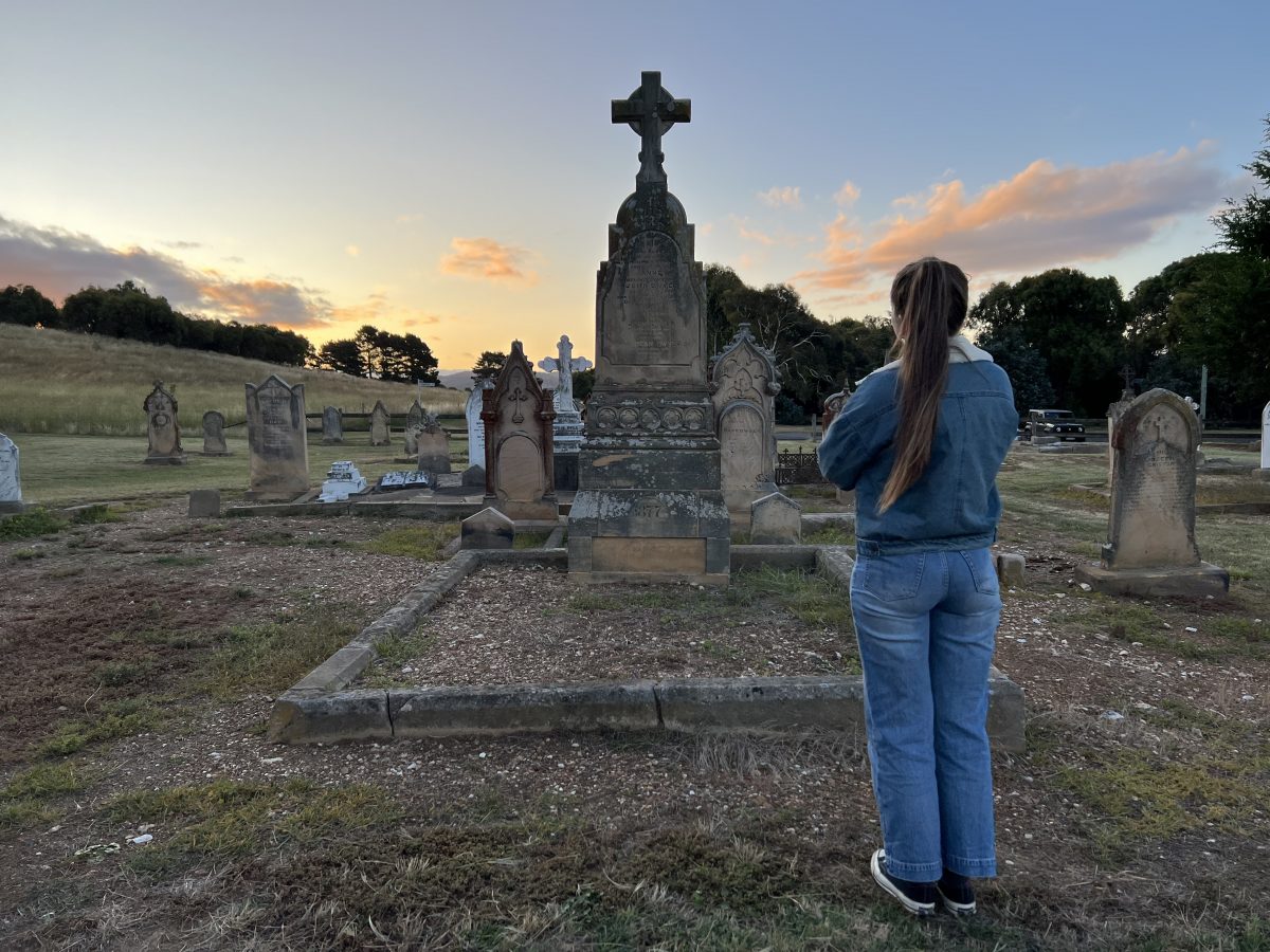 Woman at gravestone