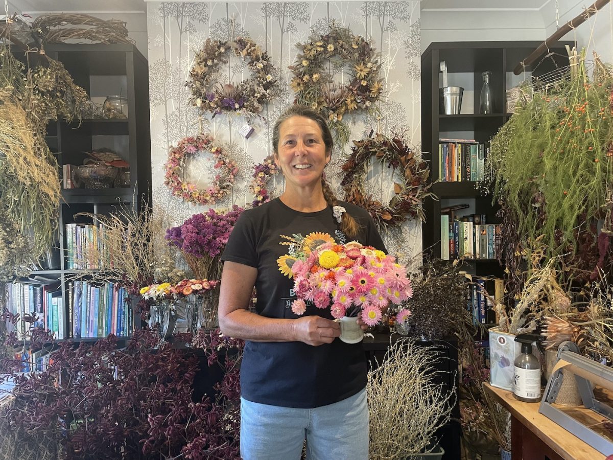 Karen Mumberson with a bouquet of flowers