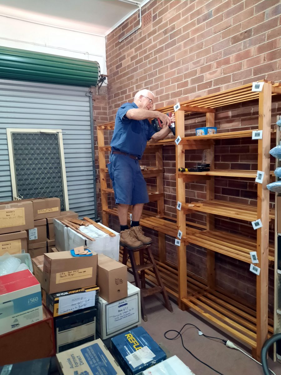 Man putting up shelves