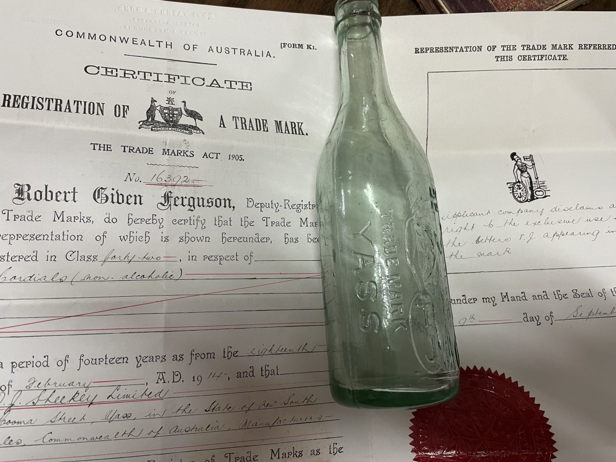 Old bottle with certificate
