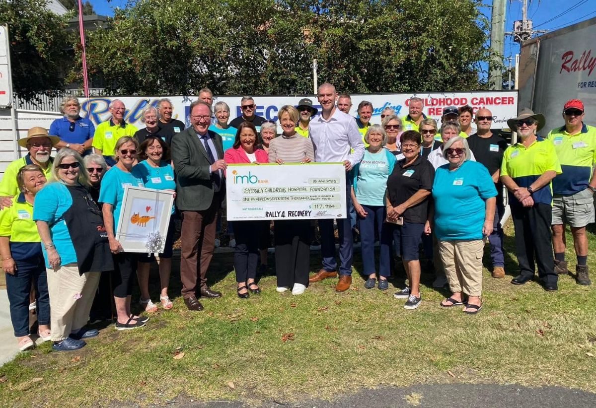 group of people with big cheque