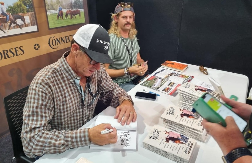 man and son at book signing