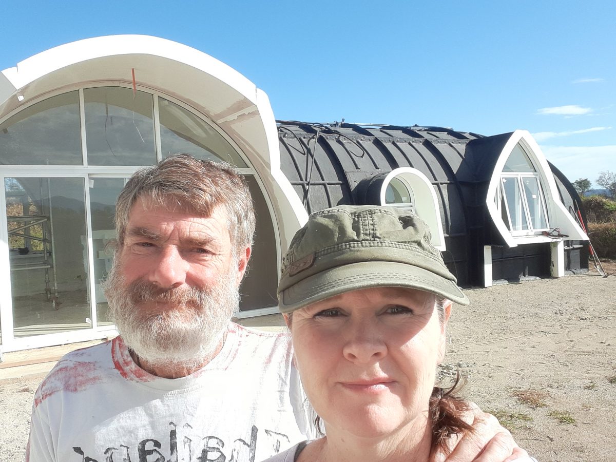 Man and woman at their partially built house