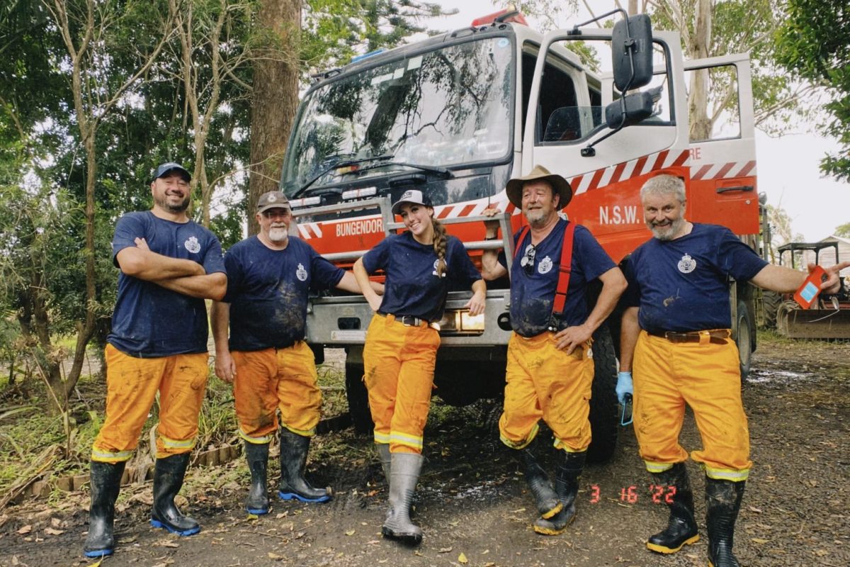 Vokunteer firefighters in front of their truck.