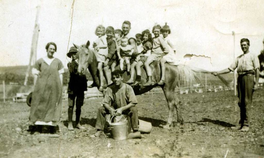 family with kids on horseback