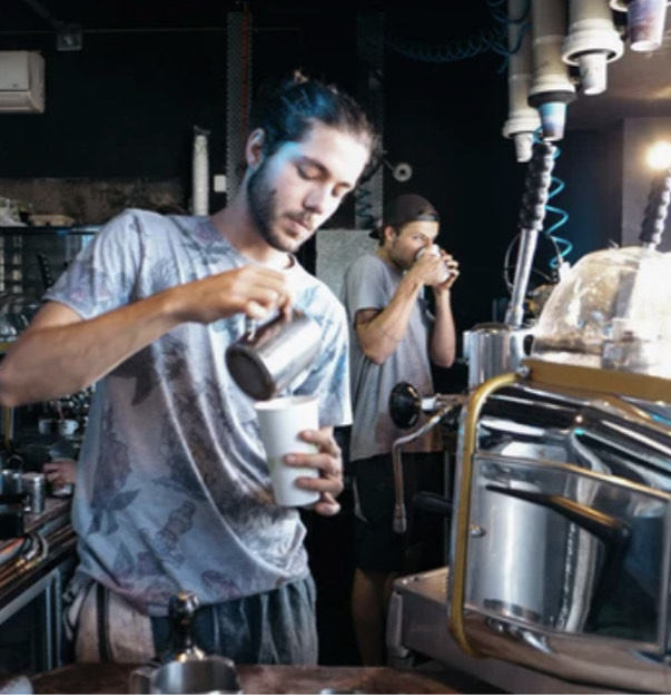 A barista at Hyper Hyper in Nowra pours an in-house blend for a customer 