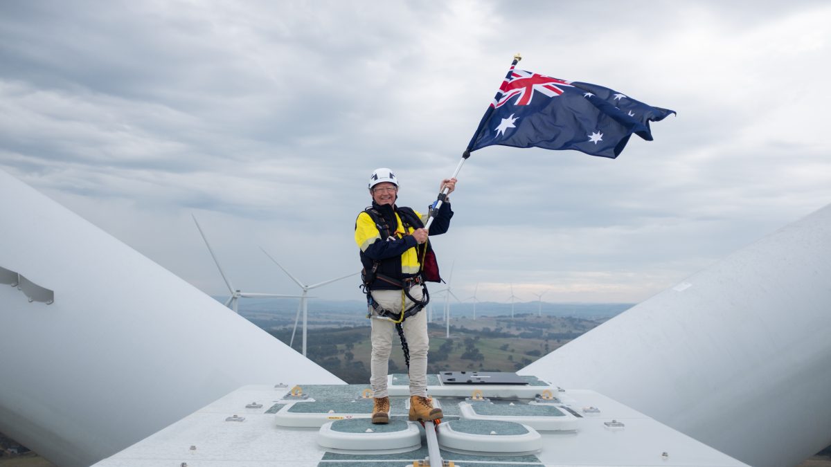 man on wind turbine